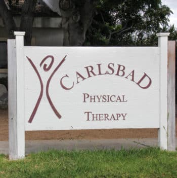 A sign for carlsbad physical therapy.